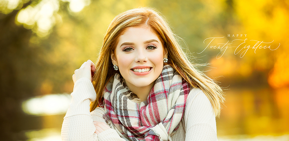 Senior girl photo with bright fall colors behind her by Angie Windheim Photography