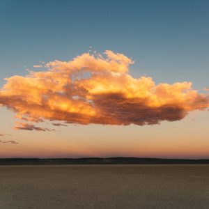 Alvord Desert with sunset making cloud float and orange